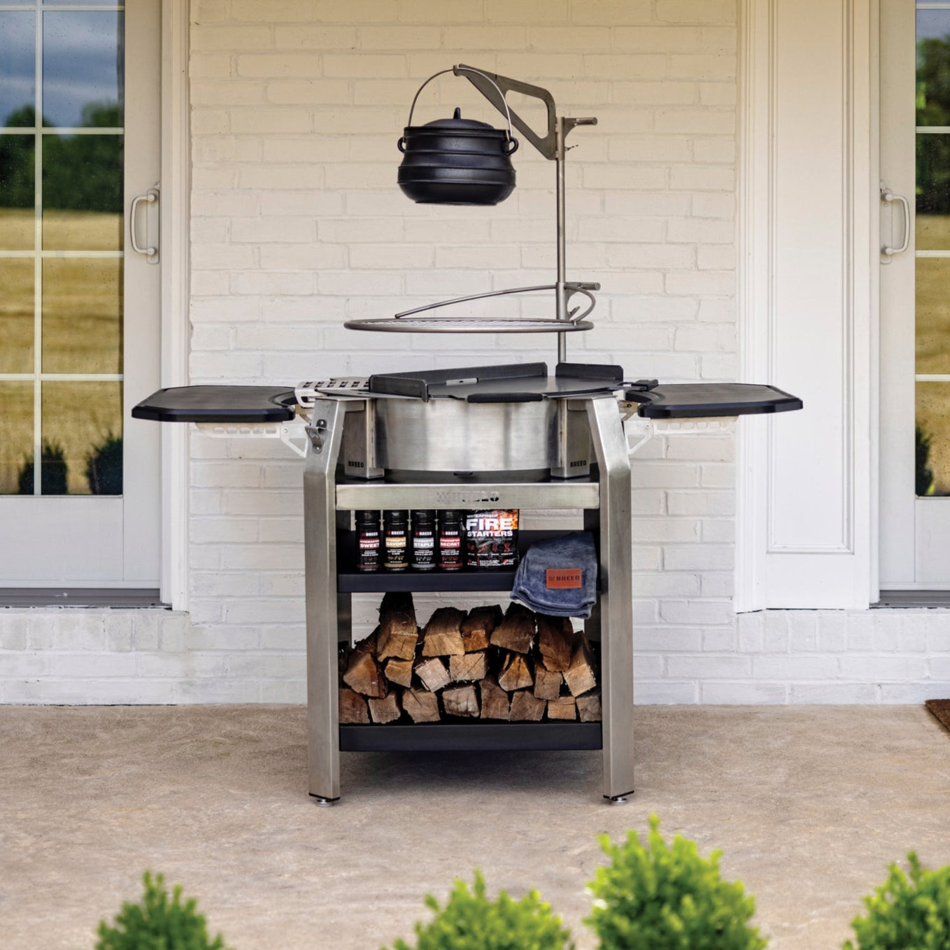 breeo firepit bundle on porch with white house in background
