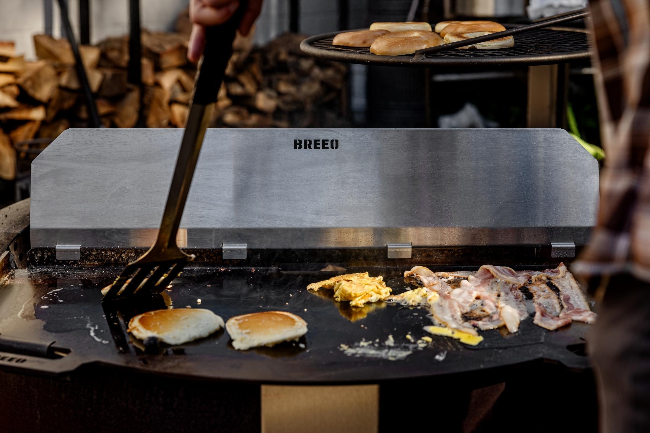 This is an image of a person grilling on a Flat Top 42
