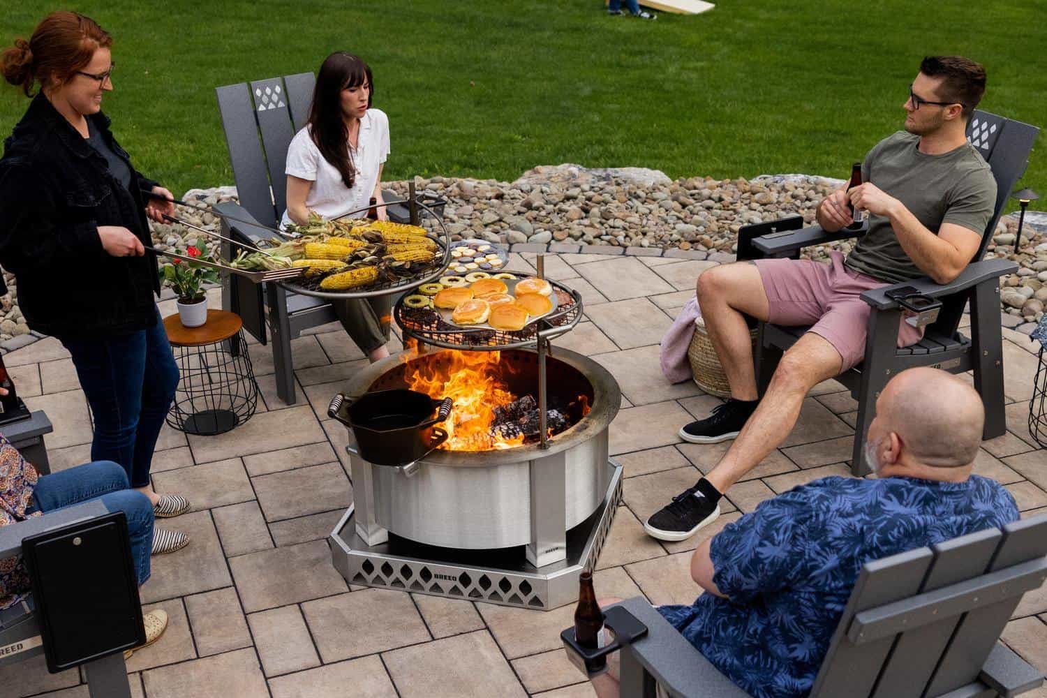 X30 Stainless with grilling attachments and a group of friends hanging out