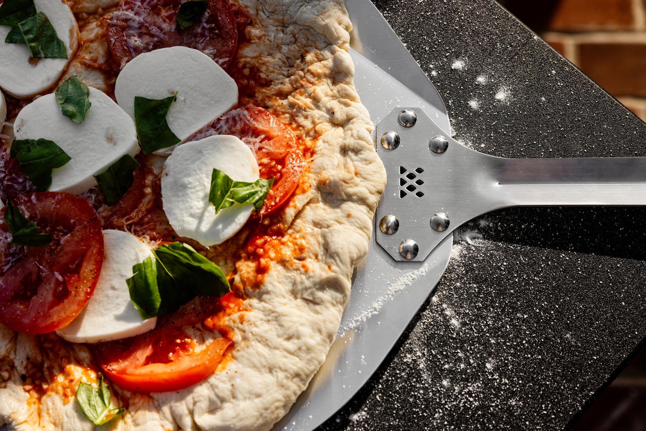 This is an image of Pizza on a Breeo Pizza Peel