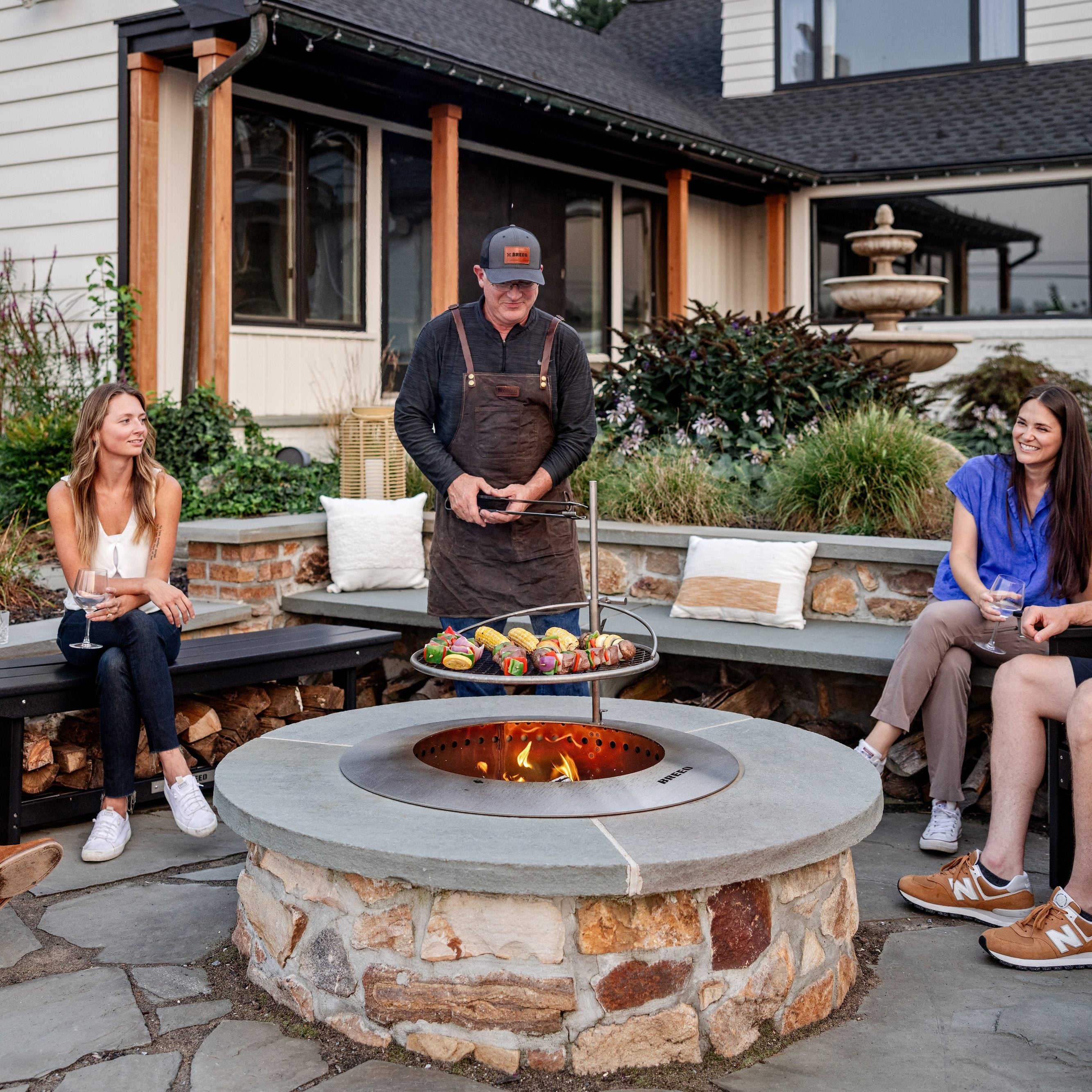 people sitting around zentro 30 cooking food
