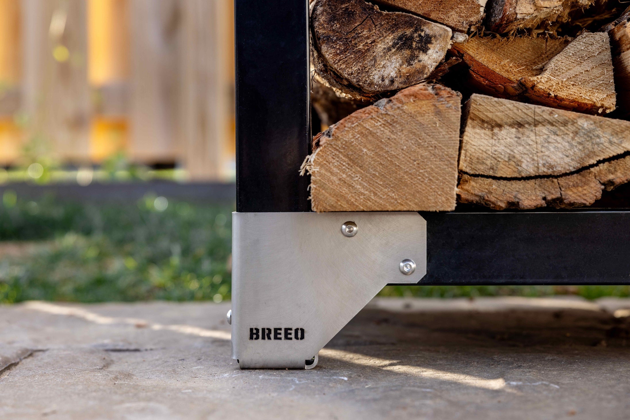 A closeup of the stainless steel feet on the firewood rack.