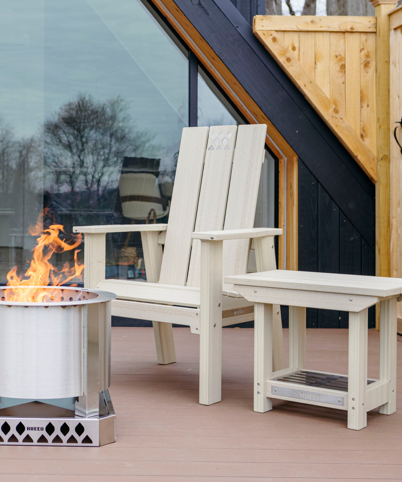 Birchwood breeo chair and side table on patio with breeo smokeless firepit