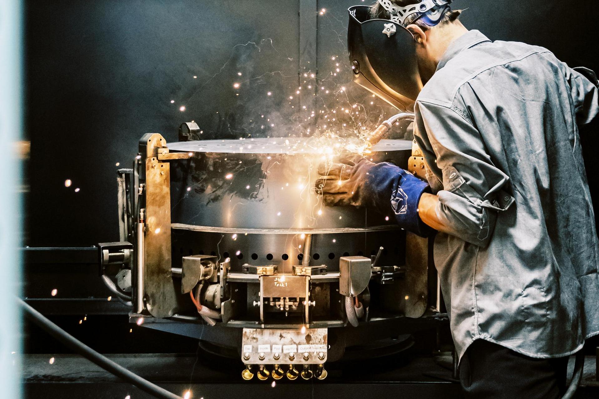 An American worker welding an X 24 fire pit in Breeo's manufacturing center in Lancaster, Pennsylvania.