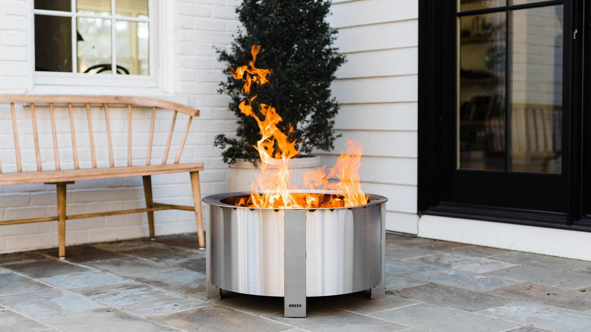 This is an image of an X Series Stainless firepit on a patio