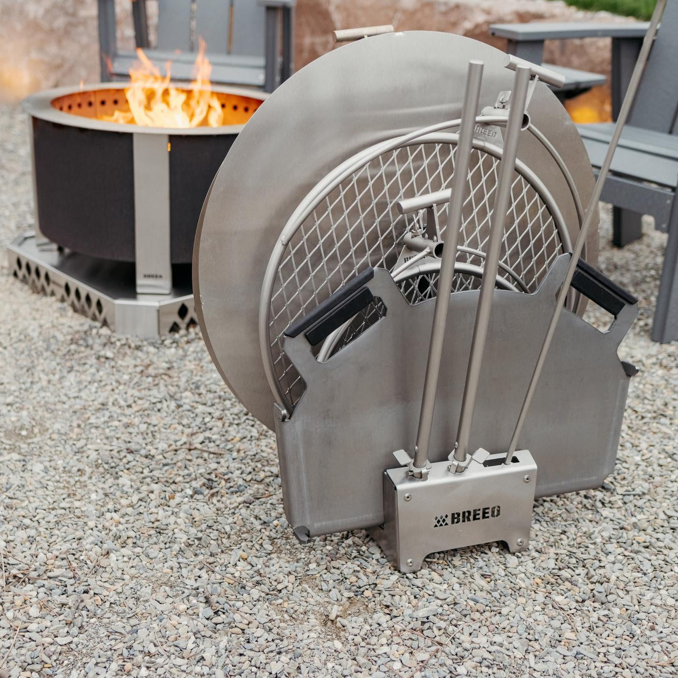 Breeo 304 Dock with a metal basket and tools on a gravel surface.