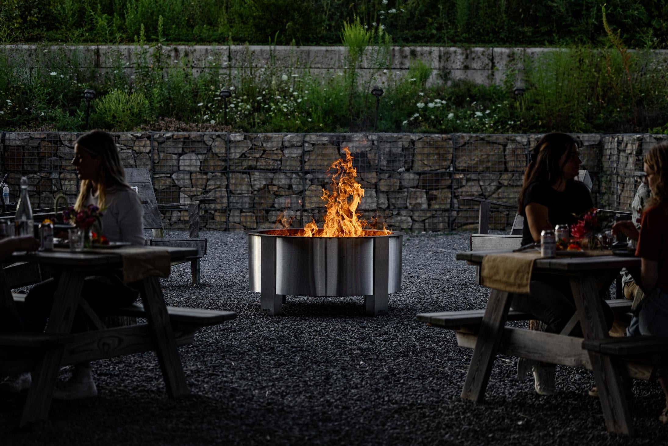 X42 stainless firepit with friends eating 