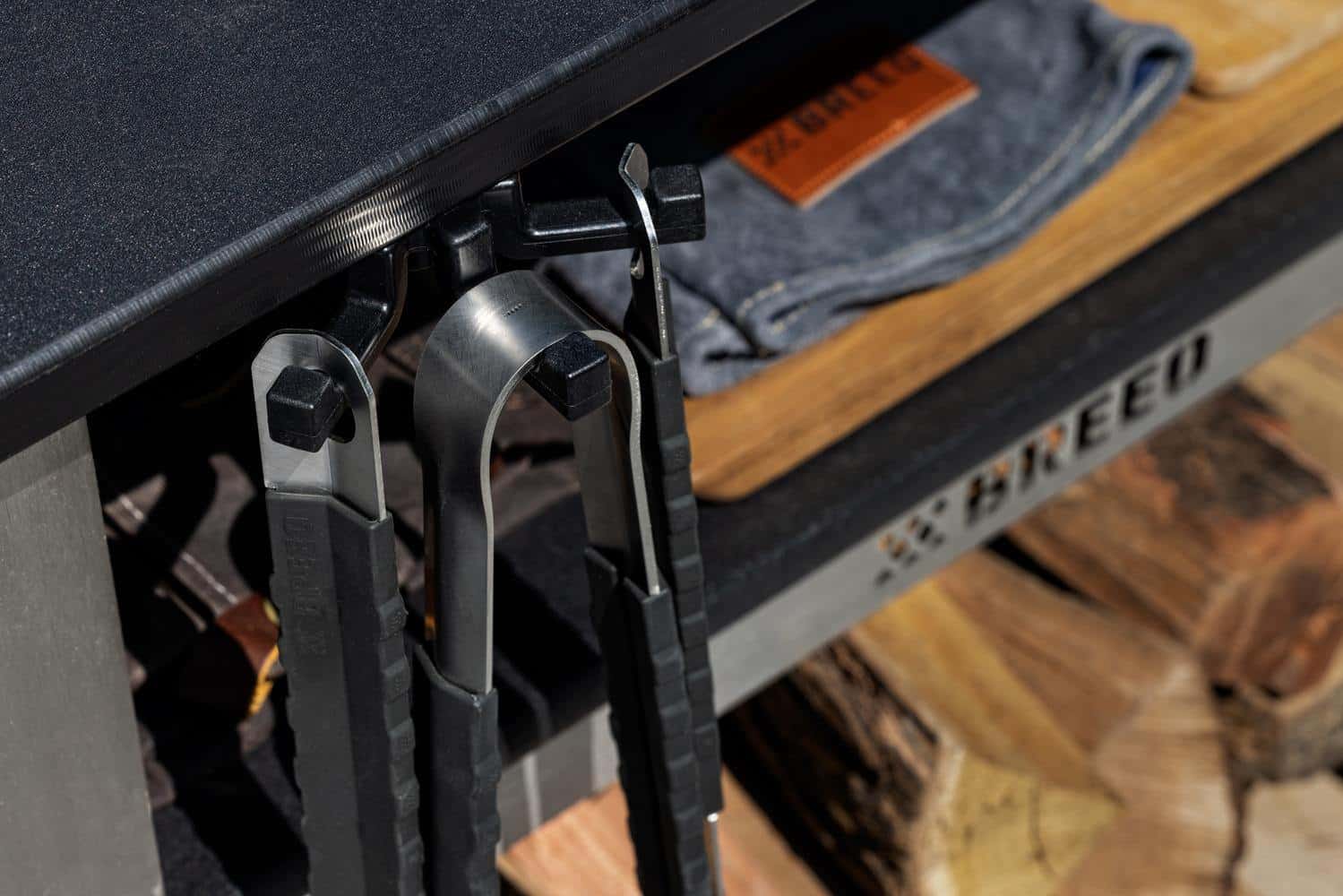 The Breeo Grilling tools hanging from the Breeo Tri-Hook